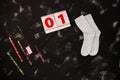 White socks and school supplies on black background. The first of september. Back to school concept Royalty Free Stock Photo