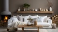 White sofa with blanket and wooden coffee table against fireplace with firewood