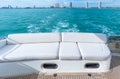 White sofa set on a luxury yacht stern interior