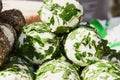 White soft cheese in greens Royalty Free Stock Photo