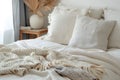 white soft duvet on background of headboard with pillows, bedside table with floral arrangement,close-up,concept of preparation Royalty Free Stock Photo
