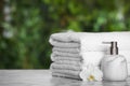 White soft towels on marble table outdoors, closeup. Space for text Royalty Free Stock Photo