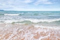 White soft wave rolling splash on empty tropical sandy beach