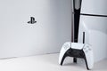 The white Sony PlayStation 5 and controller on the white table. Royalty Free Stock Photo
