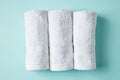 White spa towels on blue, from above Royalty Free Stock Photo