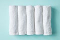 White spa towels on blue, from above Royalty Free Stock Photo