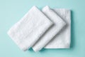 White spa towels on blue, from above Royalty Free Stock Photo