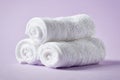White spa towels on purple background Royalty Free Stock Photo