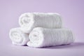 White spa towels on purple background Royalty Free Stock Photo