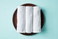 White spa towels on blue, from above Royalty Free Stock Photo