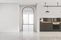 White space with stylish kitchen and archway