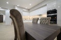 White spacious kitchen interior with dining room table and chairs Royalty Free Stock Photo