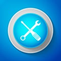 White Spanner and screwdriver tools icon isolated on blue background. Service tool symbol. Circle blue button with white Royalty Free Stock Photo