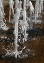 sparkling fountain splashes in summer in a city