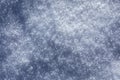 White sparkling snow surface with blue shade. Natural fresh shiny fluffy snowflakes texture. Ice crystals in bright