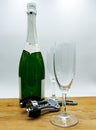 White sparkling wine, two glasses on wooden table, white background Royalty Free Stock Photo