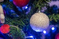 White sparkly ball ornament on Christmas tree Royalty Free Stock Photo