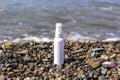 White spay bottle for mock up at the sea shore