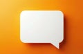 White speech bubble on orange surface. Blank text balloon for message copy. Communication balloon symbolises discussion with Royalty Free Stock Photo