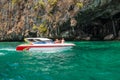 White speedboat with tourists at the cave
