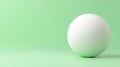 A white sphere sits on a light green background. Royalty Free Stock Photo