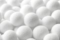 White spherical objects scattered on a surface create a textured appearance Generative AI Royalty Free Stock Photo