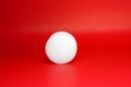 White Spherical plastic or Shockproof foam isolated red background - geometric shapes and decor Royalty Free Stock Photo