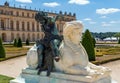 White Sphinx statue and Cupid bronze statue in the Versailles Gardens