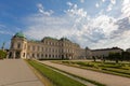 White Sphinx statue in garden with visitors sitting walking next by at Belvedere palace in Vienna, Austria