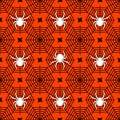 White spiders with black cobwebs on an orange background. Halloween seamless pattern for t-shirts or packaging Royalty Free Stock Photo