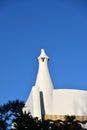 White spire of the building under a blue sky Royalty Free Stock Photo