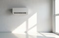 White split air conditioner mounted on light textured wall. Sunlight streams through large window, casting geometric shadows Royalty Free Stock Photo