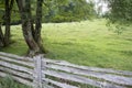White split rail fence along a pasture with trees on the Blue Ridge Parkway Royalty Free Stock Photo