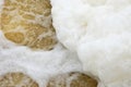 White sponge heap on seethe of the stream Royalty Free Stock Photo