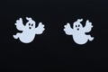 White spooks silhouettes on black Halloween background Royalty Free Stock Photo