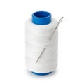 White sewing thread spool with a silver needle inserted into the top on a white background Royalty Free Stock Photo