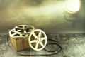 White spools of old film in the spotlight. Royalty Free Stock Photo