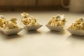 White spoon with popcorn. Royalty Free Stock Photo