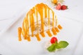 White spoonge peice of cake with orange syrup Royalty Free Stock Photo