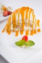 White spoonge peice of cake with orange syrup Royalty Free Stock Photo