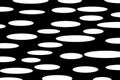 White spotted background pattern, horizontal white oval shapes on black background for packaging, fabric, wallpaper