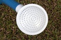 White Spout of Watering Can on Green Grass Royalty Free Stock Photo