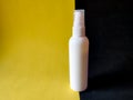 White spray dispenser bottle for cosmetics product.