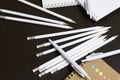 White spring pads, simple pencils and ballpoint pens for notes and sketches. Near a notebook of a different color. Stationery for Royalty Free Stock Photo