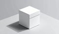 White square gift box with lid positioned on a corner of a light gray surface casting a shadow Royalty Free Stock Photo