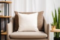 White square canvas pillow mockup template. Blank soft decorative pillow on an armchair in living room at home Royalty Free Stock Photo