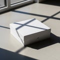 A white, square cardboard box with Royalty Free Stock Photo