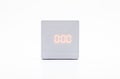 White, square digital clock on white background with clipping path.