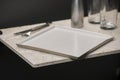 White, Square Dining Plate with Glasses, Knife, and Fork Royalty Free Stock Photo