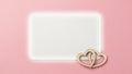 White square frame with two lightbrown wooden hearts on pink pastel background for wedding or valentines day design concept Royalty Free Stock Photo
